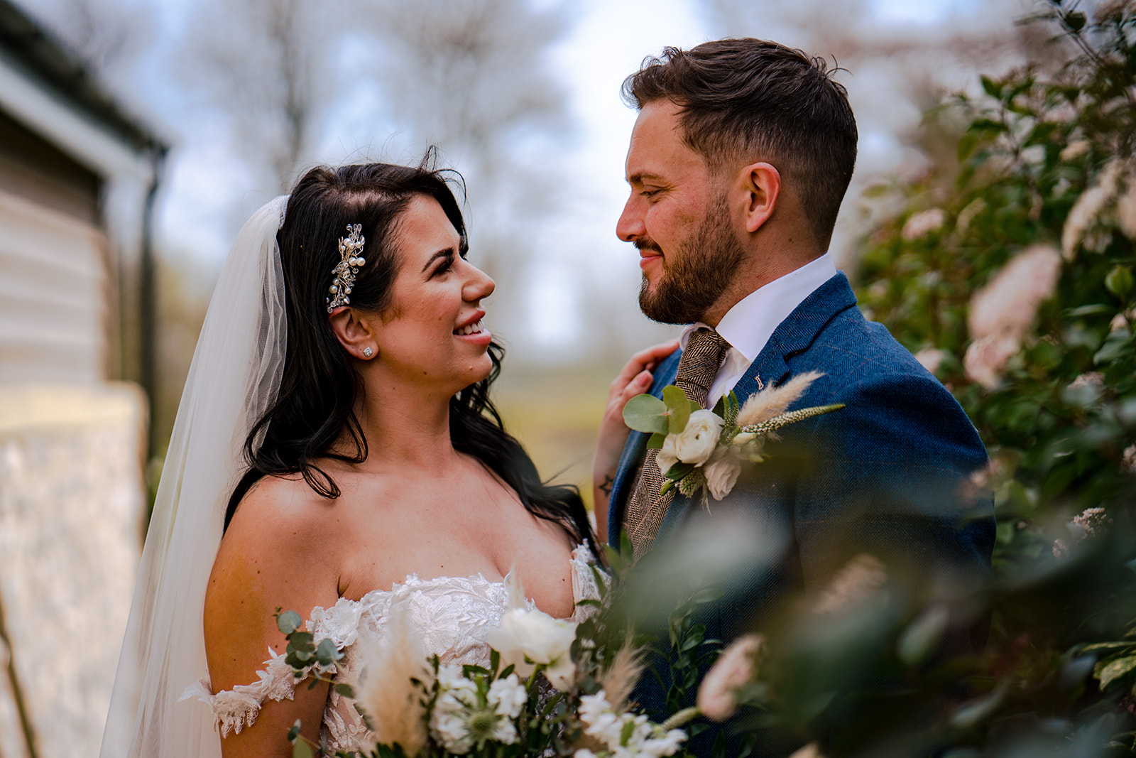 Katie smiling at Jack during a quiet couple portrait at The Gamekeeper’s Inn
